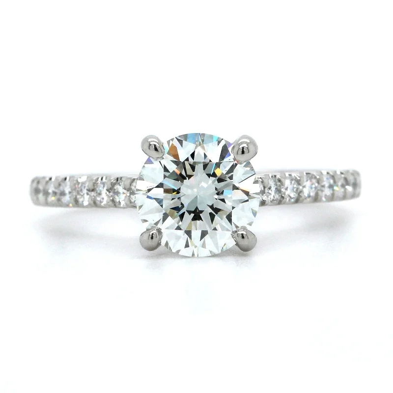 Platinum Round Diamond Side Stones Engagement Ring